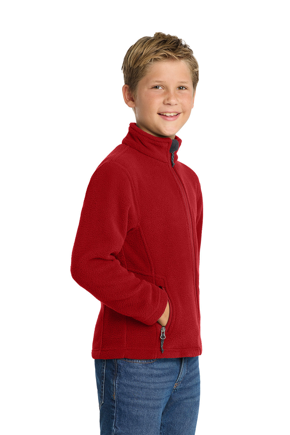 Young boy wearing a red fleece jacket on a white background. Port Authority® Youth Value Fleece Jacket, Embroidered by Helmsman Stitch Co.